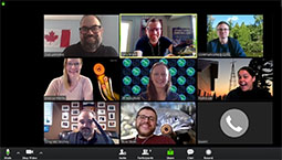 Zoom meeting display with communications staff showing off new background images